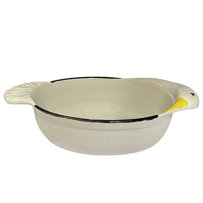 White ceramic bowl with black rim and a goose head decoration on a white background