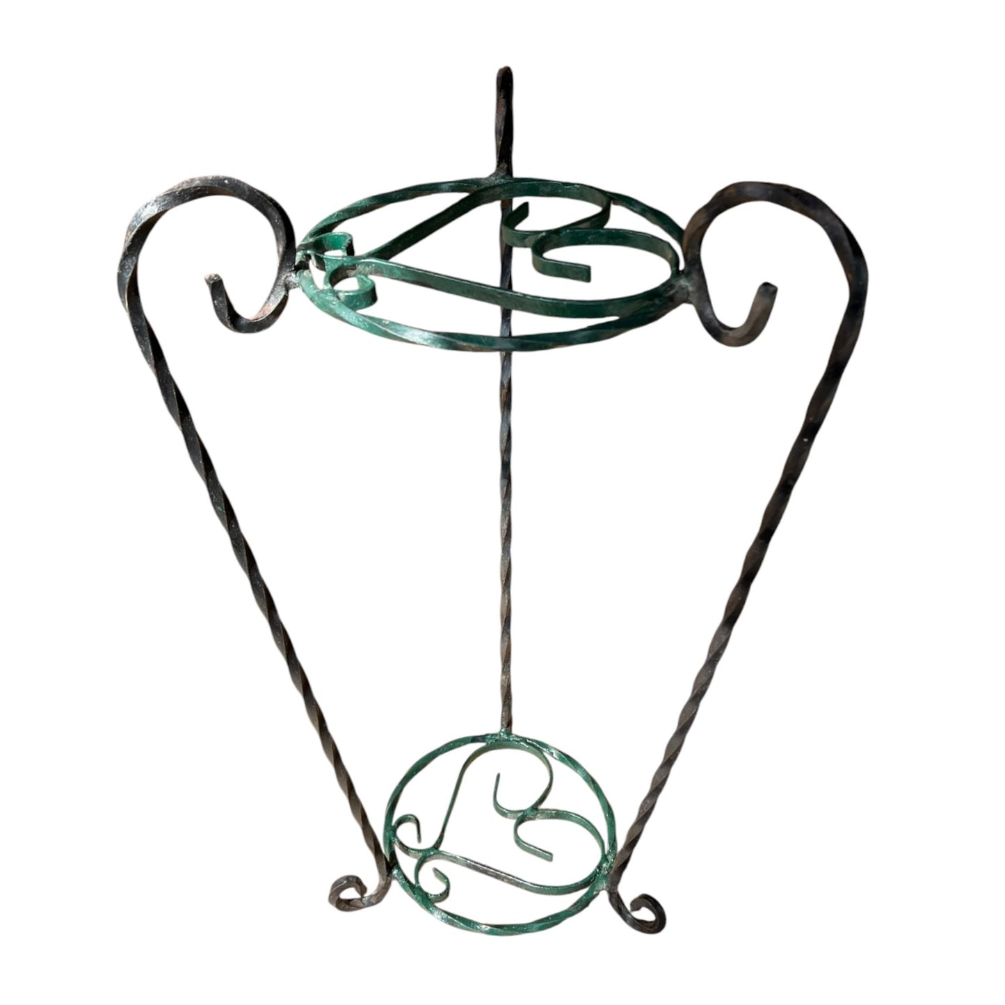 Green and black wrought iron jardinière scrolled plant stand on a white background