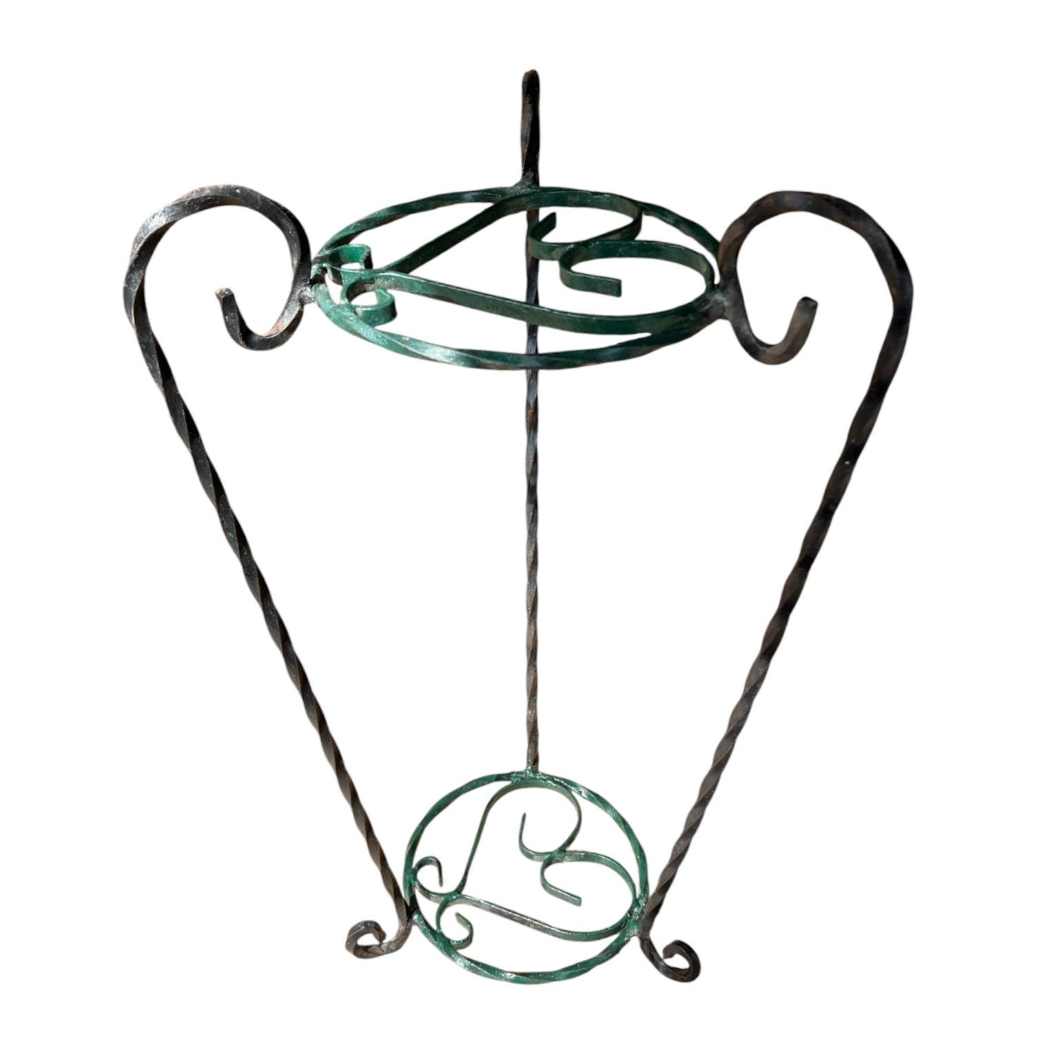 Green and black wrought iron jardinière scrolled plant stand on a white background