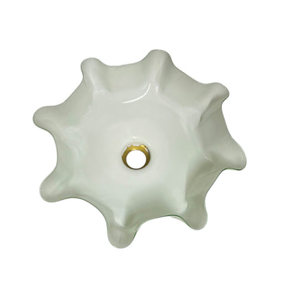 close up of the inside of a glass lampshade on a white background