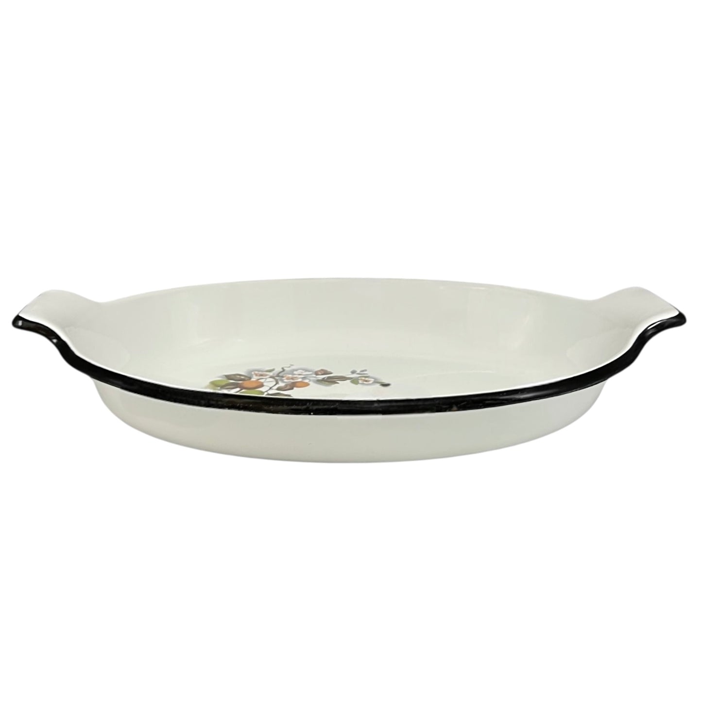 White enamel dish with black rim on a white background