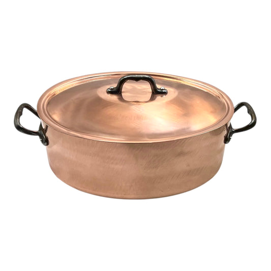 Copper pot with lid on a white background