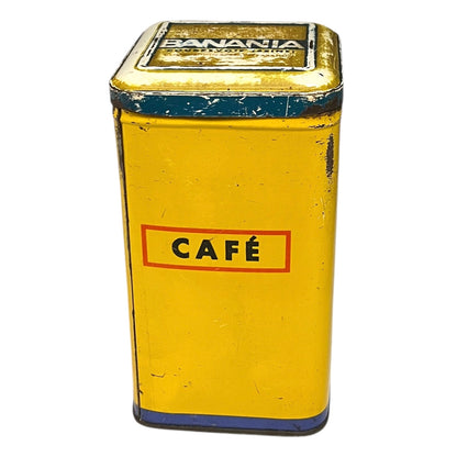 Vintage tin can with a colorful design featuring a face and 'Banania' branding on a white background.