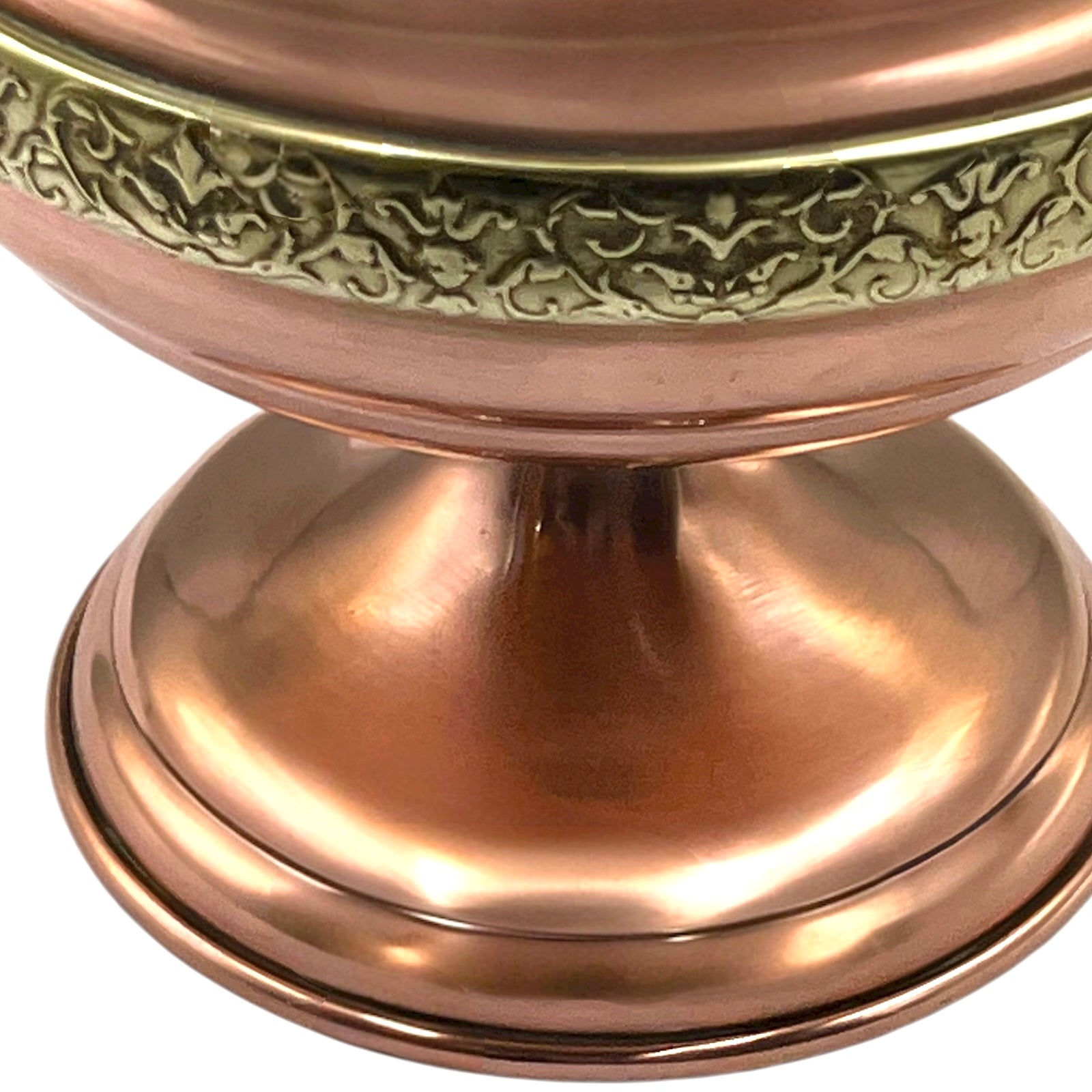 Copper lamp base with intricate engravings on a white background