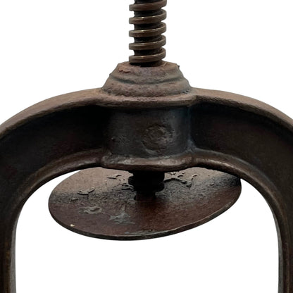 Close-up of a vintage French fruit press with an enamel pot on a white background