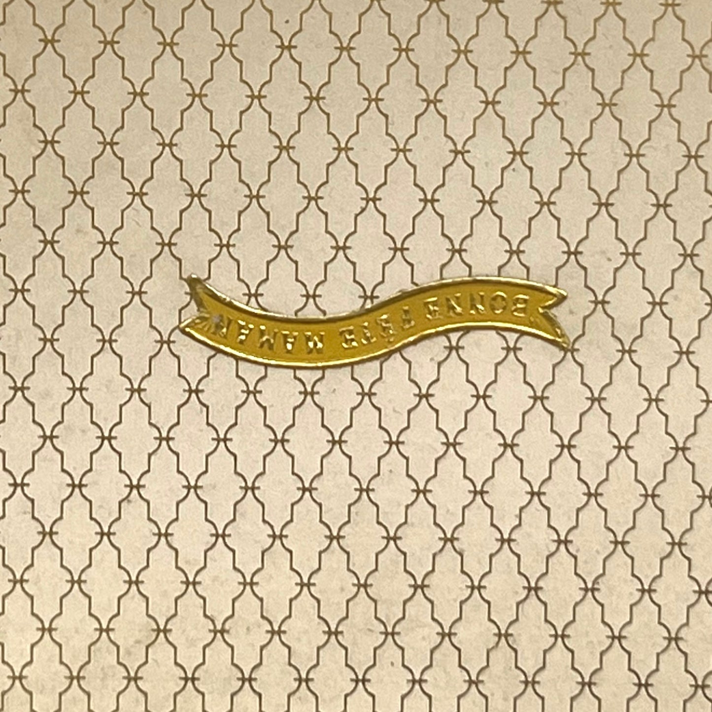 Close-up of a patterned box with the French words for Happy Mothers Day 
