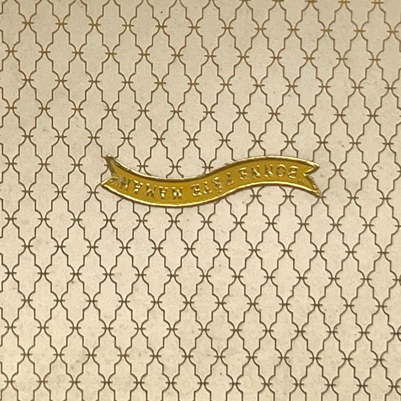 Close-up of a patterned box with the French words for Happy Mothers Day 