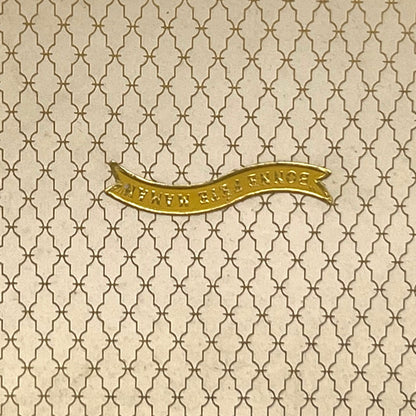 Close-up of a patterned box with the French words for Happy Mothers Day 