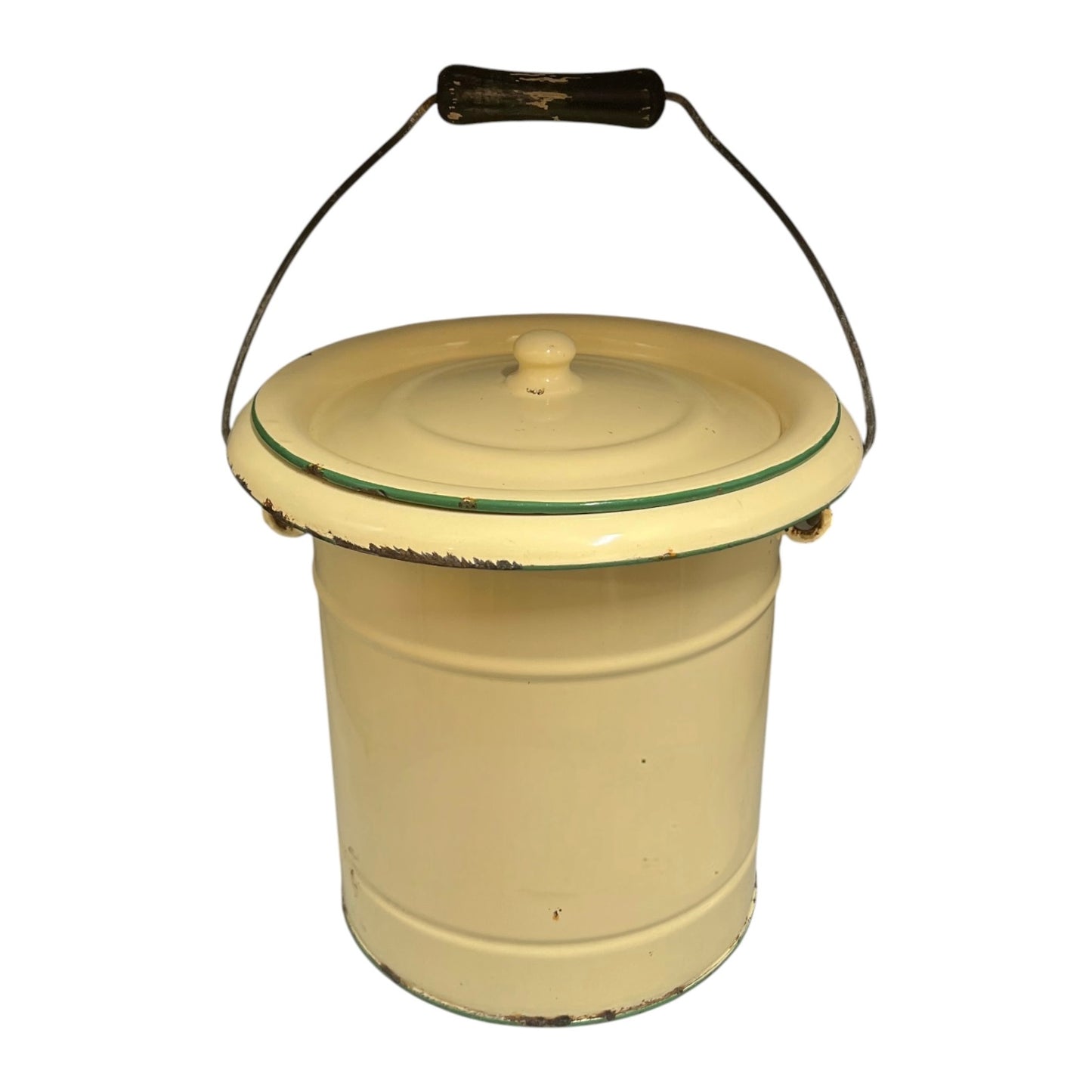 A charming French vintage enamel lidded potty bucket with a wooden handle, featuring a cream finish accented by a green trim. Perfect for use in a farmhouse kitchen as a vegetable or bread bin, or repurposed as a unique garden planter, displayed against a crisp white background.