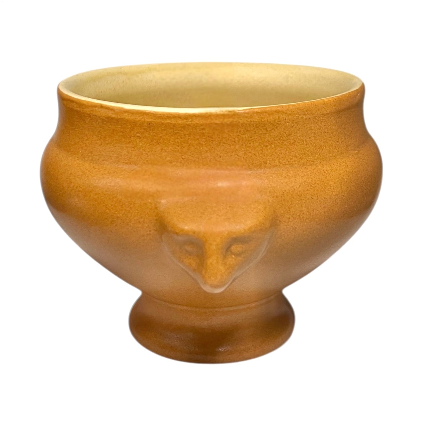 light brown ceramic French soup bowl with lions head handles on a white background 