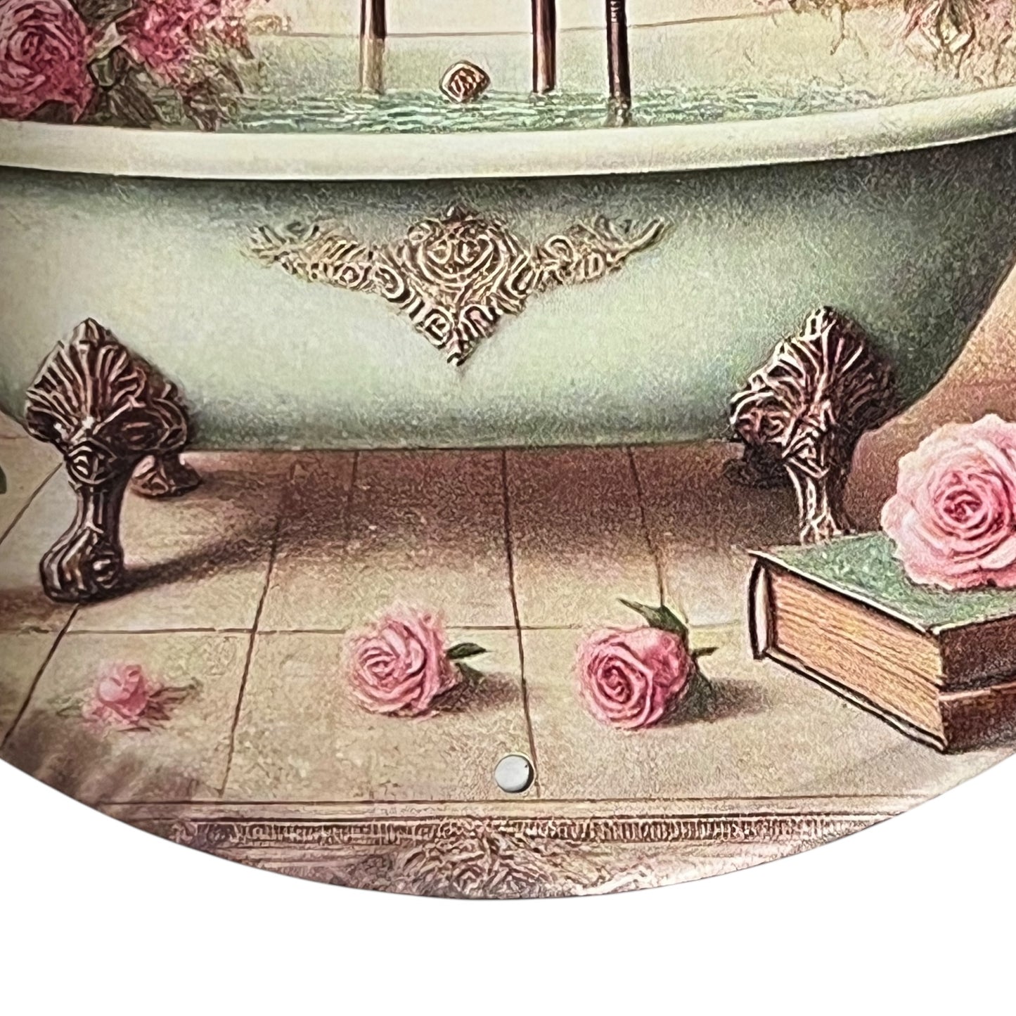 Vintage-style bathtub with decorative elements and pink roses on a tiled floor.