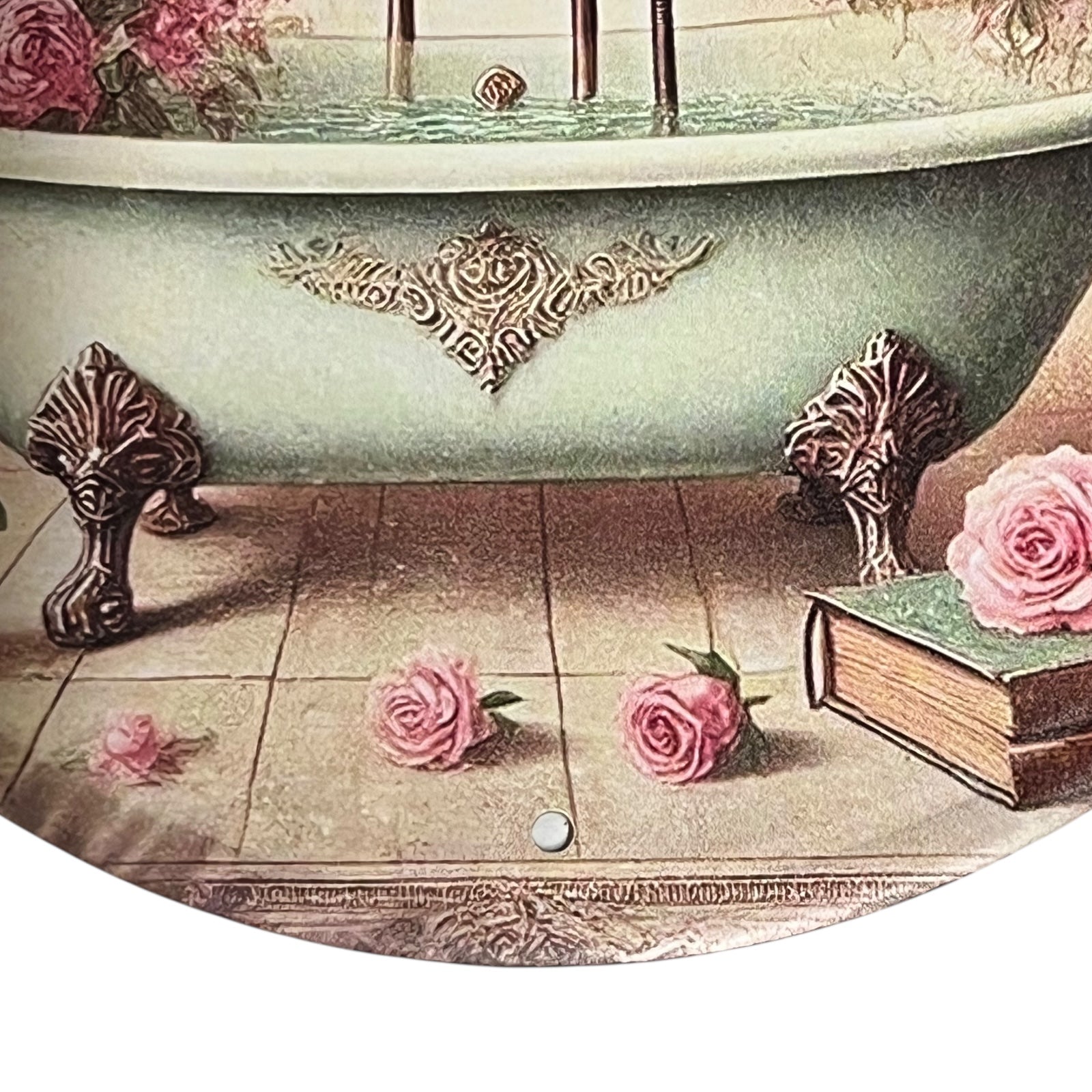 Vintage-style bathtub with decorative elements and pink roses on a tiled floor.