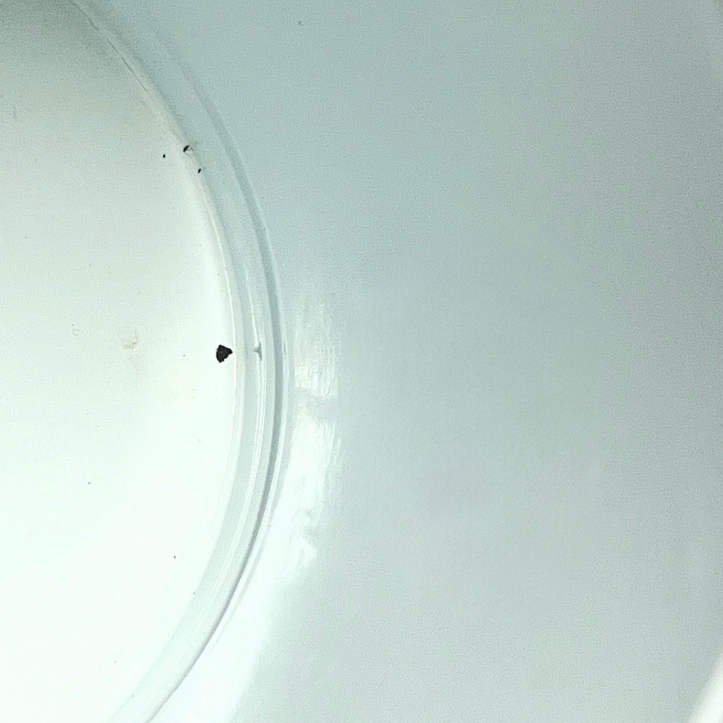 Close up of a red vintage French enamelled coffee pot on a white background
