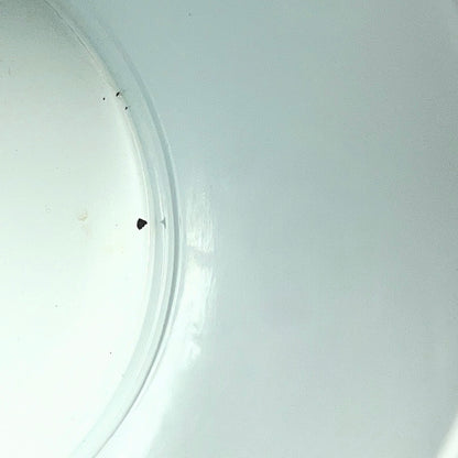Close up of a red vintage French enamelled coffee pot on a white background