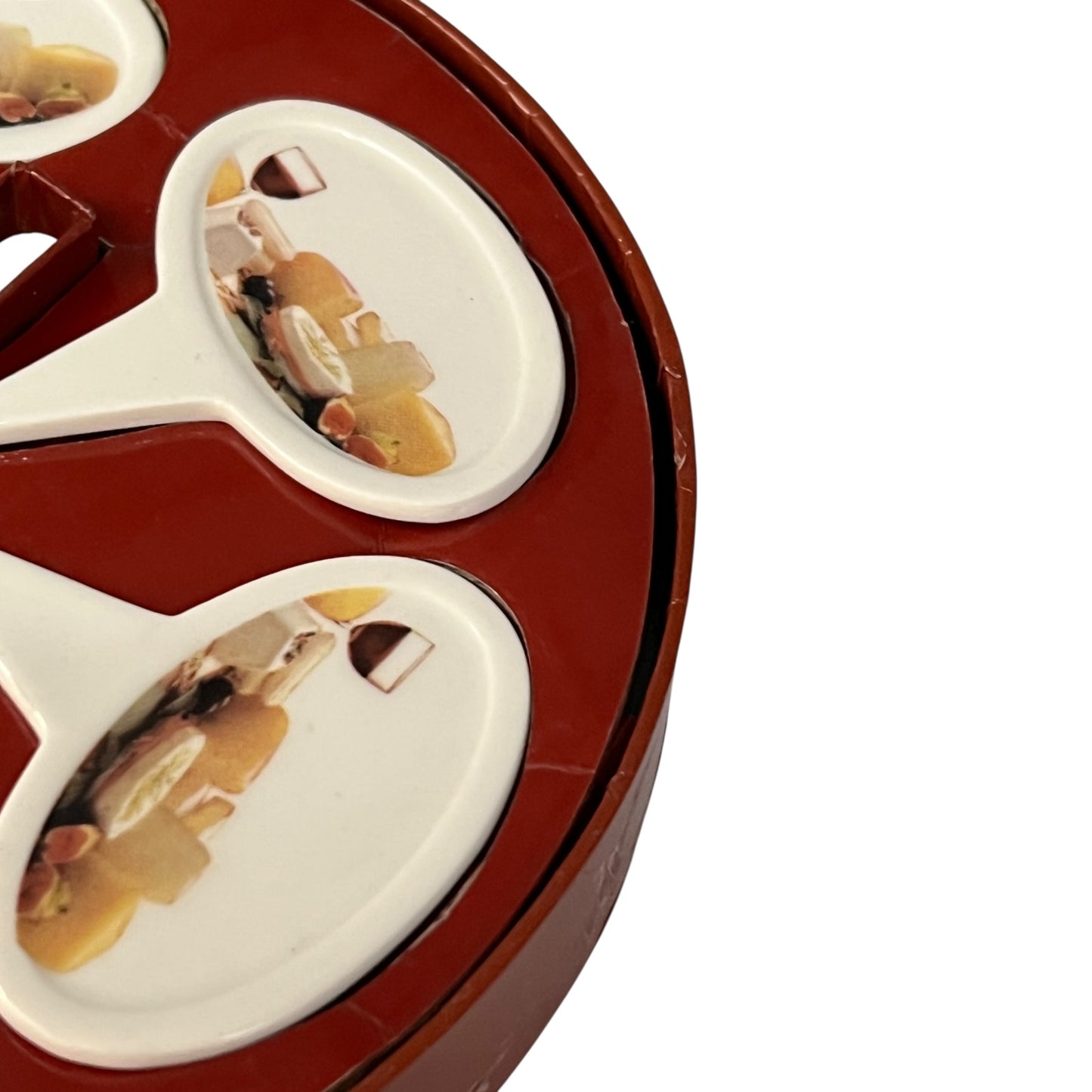 Close up of a porcelain cheese label in a red box on a white background