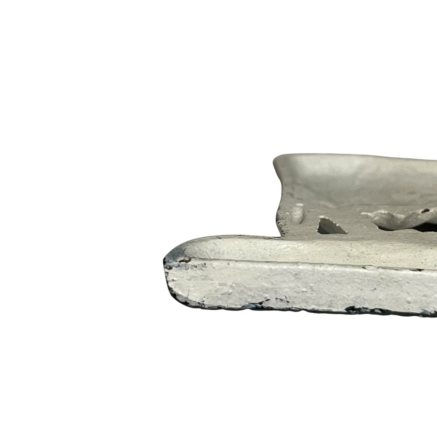 Close-up of a toilet roll holder on a white background
