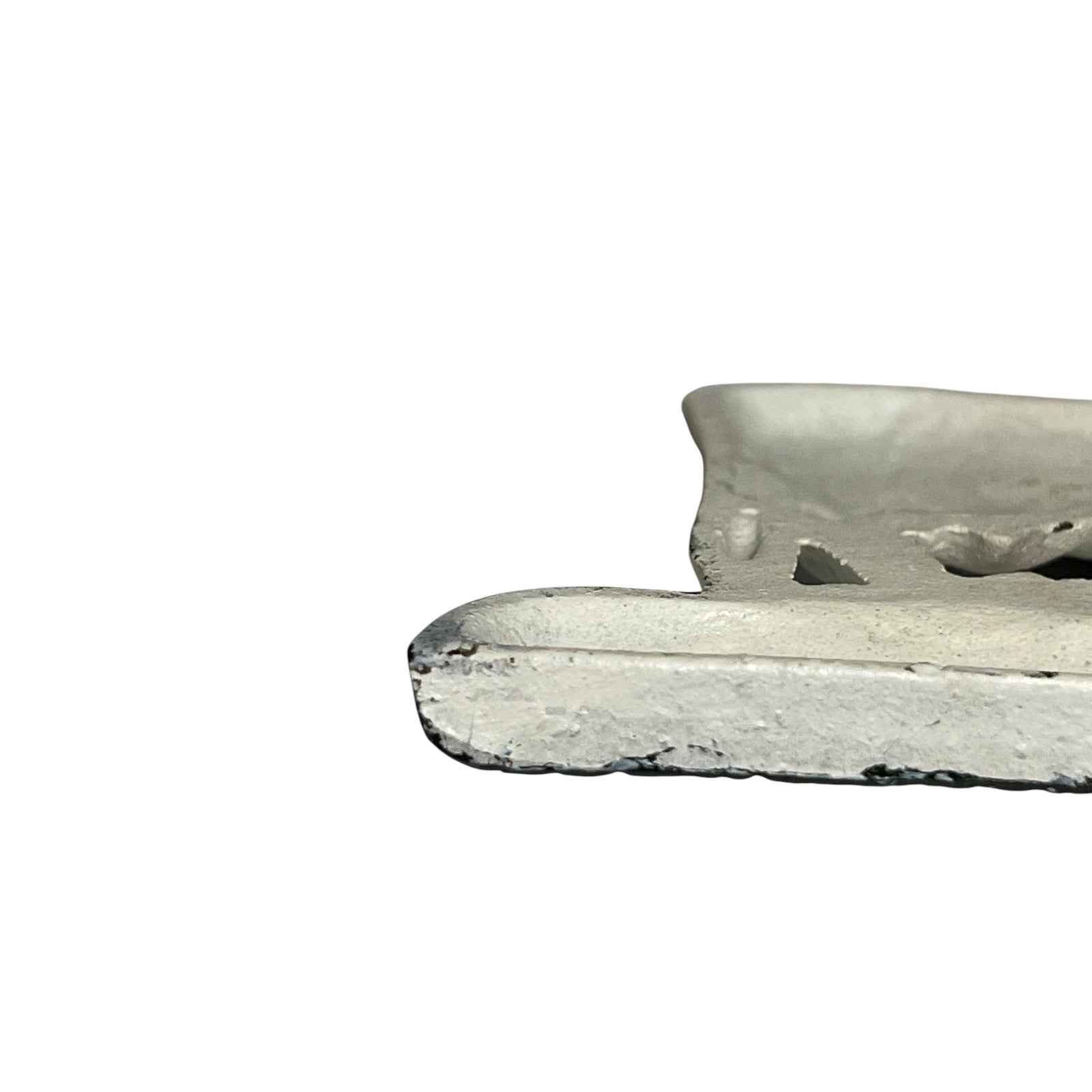 Close-up of a toilet roll holder on a white background