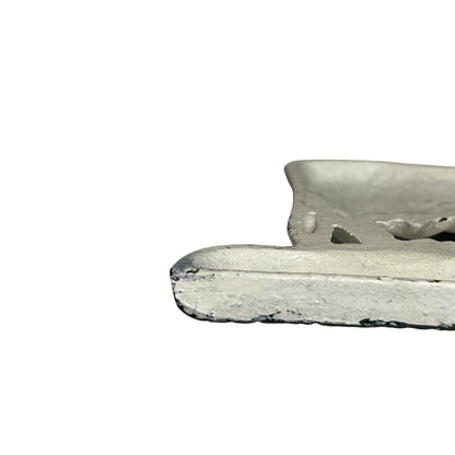 Close-up of a toilet roll holder on a white background