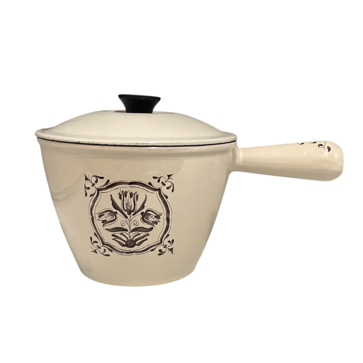 Le
Creuset saucepan and lid on a white background 