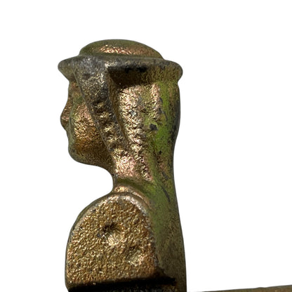 Close up of a French decorative shutter brackets on a white background