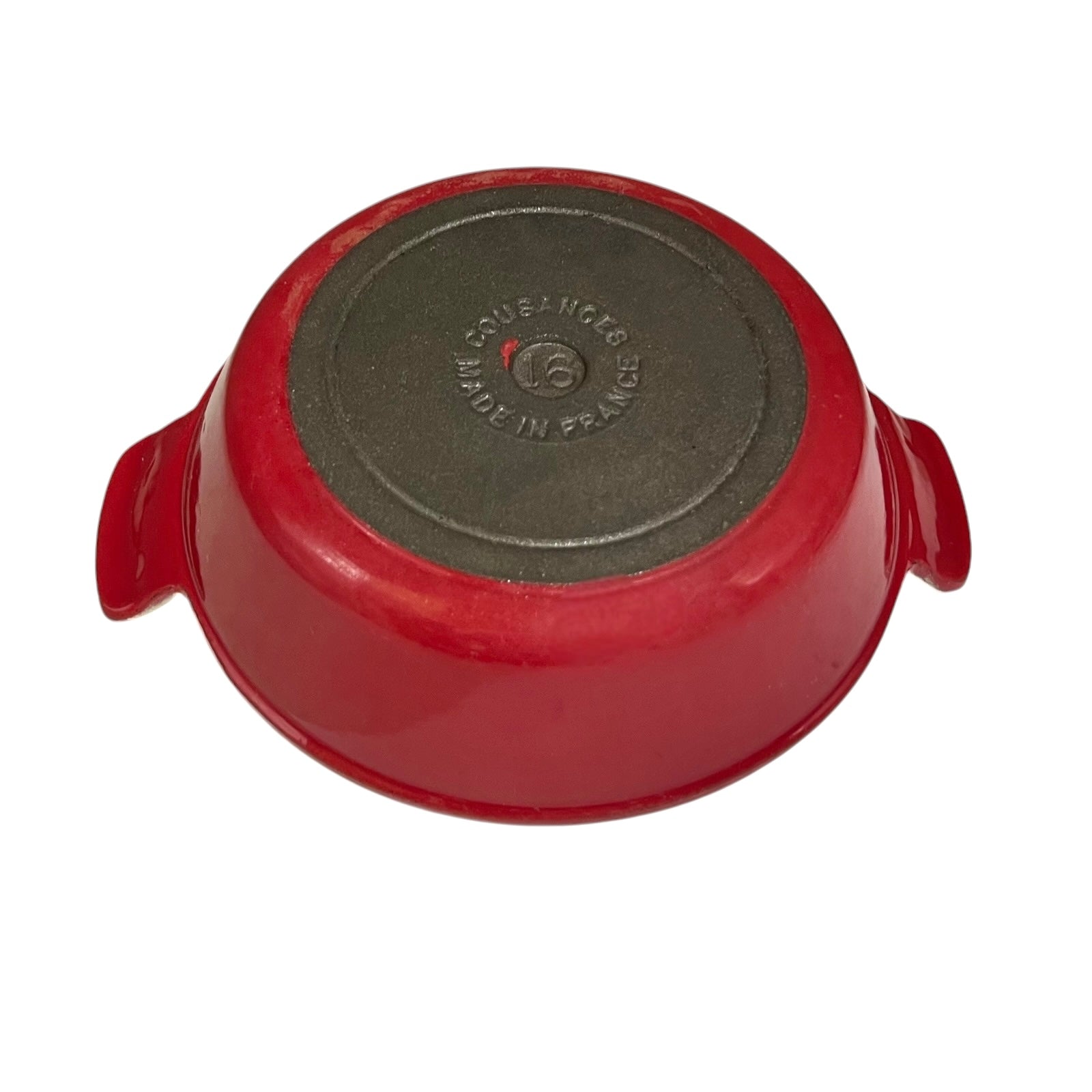 Red enameled cast iron Dutch oven shown from the bottom, displaying the dark gray non-stick coated interior and side handles on a white background.