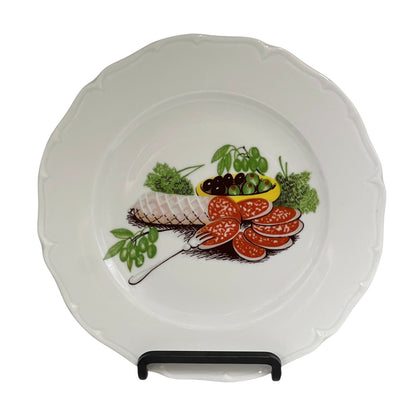 Porcelain plate with decorative salad vegetable illustrations on a white background
