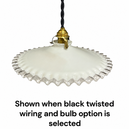 A vintage-style pendant light with a white ribbed glass shade and a brass-colored metal fitting, suspended by a black twisted wire. Text below reads: 'Shown when black twisted wiring and bulb option is selected'.