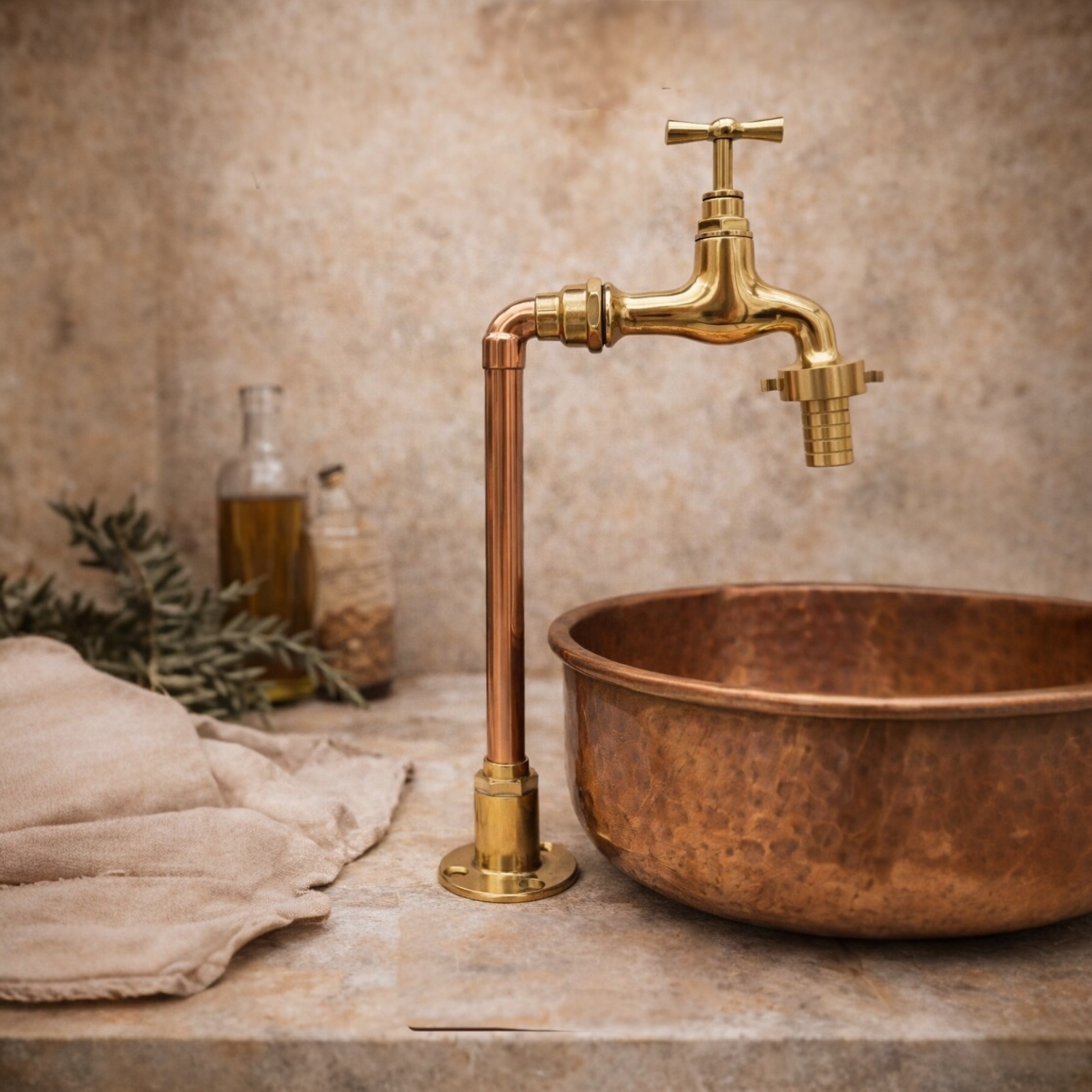 Copper sink with gold faucet on a neutral background