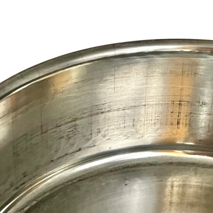 inside of copper pan with tin lining on a white background