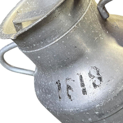 Close-up of a grey milk churn on a white background