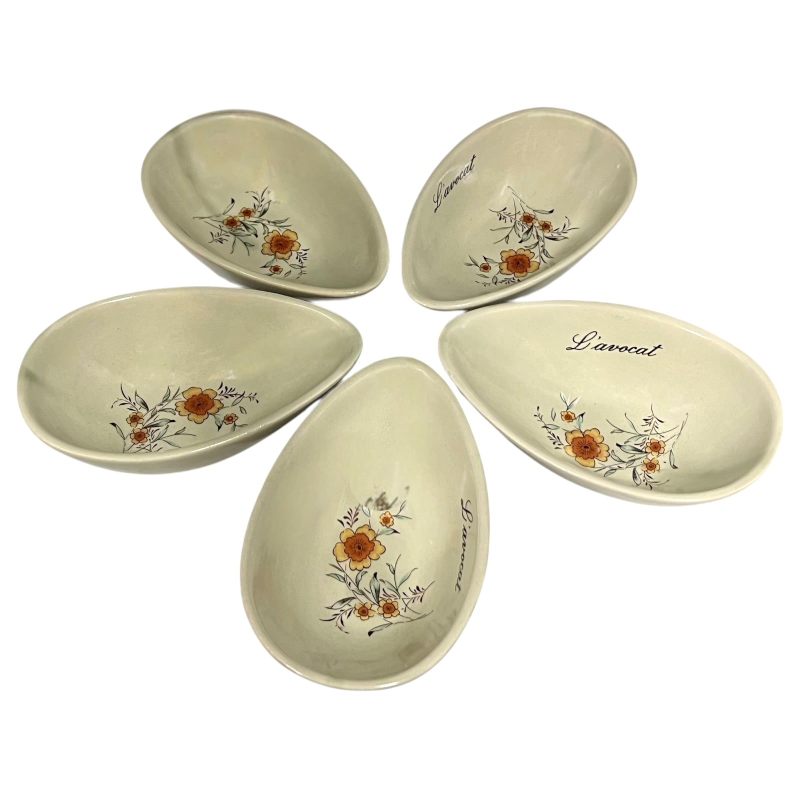 Set of five ceramic bowls with floral design and 'Lavocat' branding on a white background