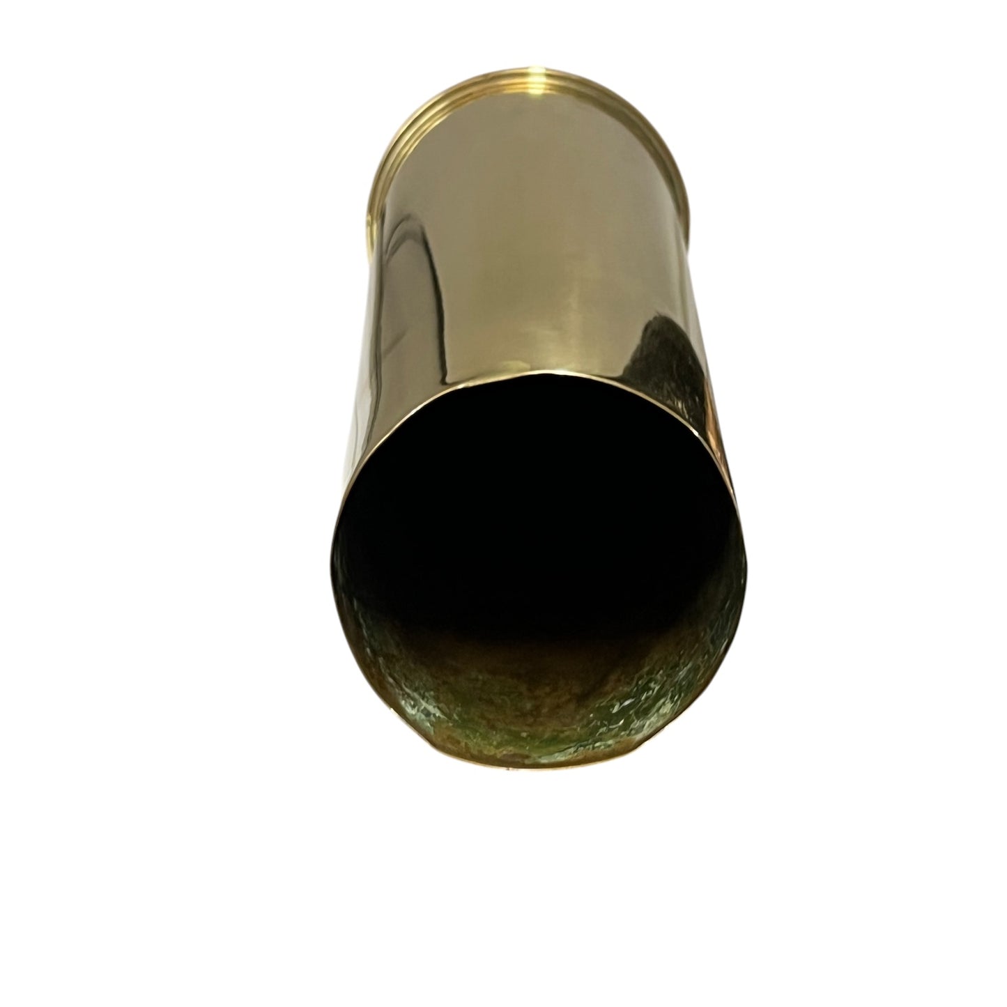 A polished brass cylindrical shell
Case  shown from a top-down perspective against a solid white background.