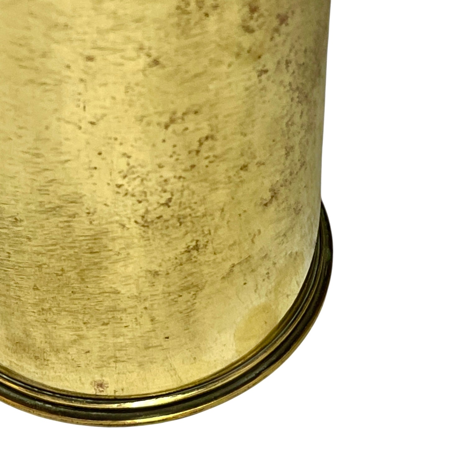 Close-up of a brass trench art shell case on a white background 