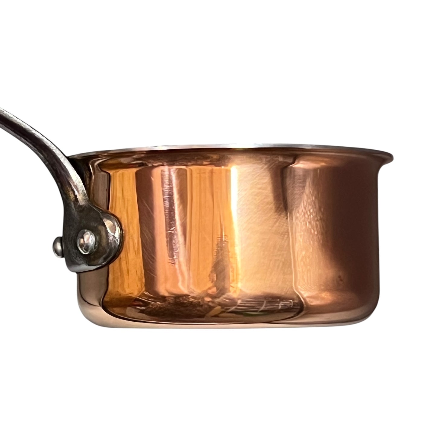 side view of copper saucepan on a white background