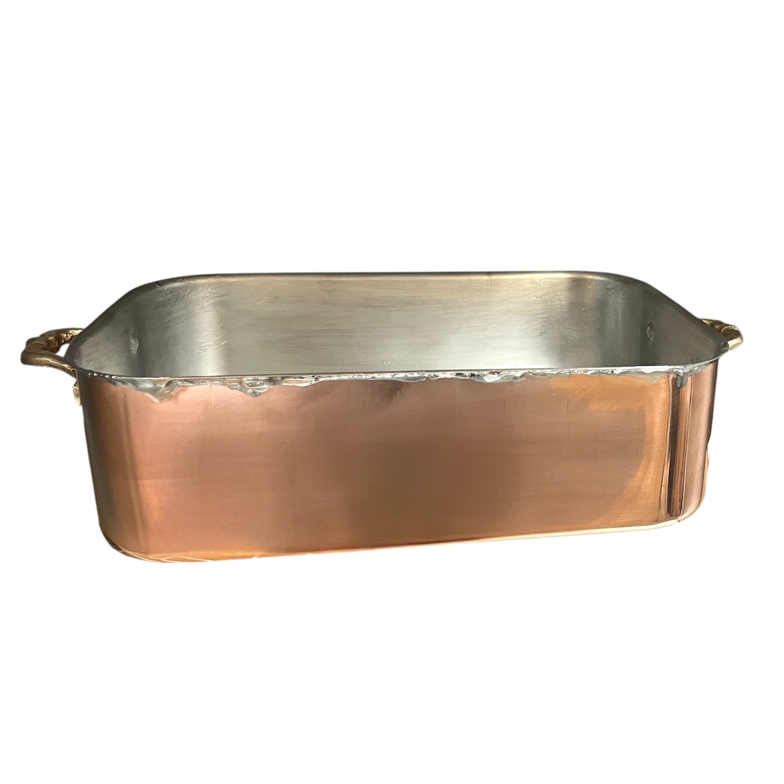 Copper roasting pan with tin lining on a white background