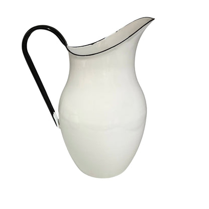 White pitcher with a black handle on a white background