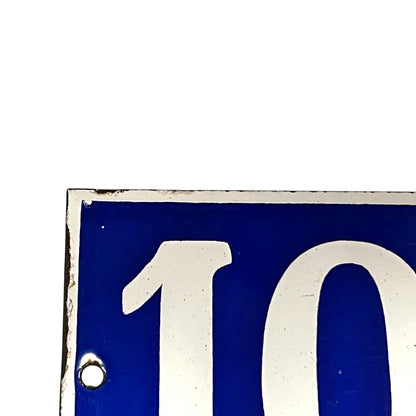 Close-up of a blue and white sign  on a white background