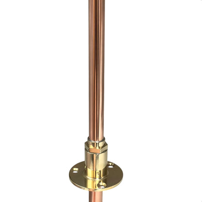 Copper pipe with brass fitting on a white background