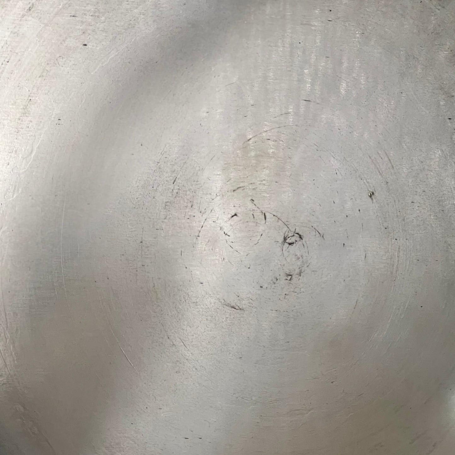 inside of copper pan with tin lining on a white background