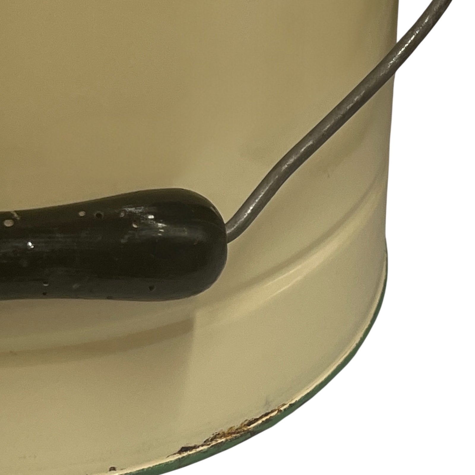 Close up of French vintage cream and green enamel bucket with a lid and handle on a white background
