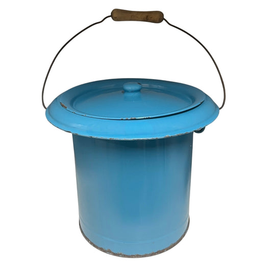 Blue metal bucket with a wooden handle on a white background
