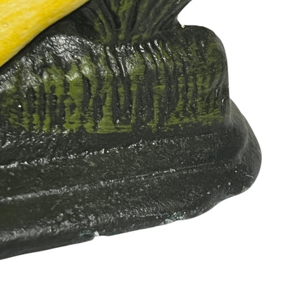 Close up of cast iron doorstop on a white background