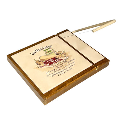A wooden tiled top cheese cutting board with a wooden handle, featuring an illustrated and written guide on the top surface.