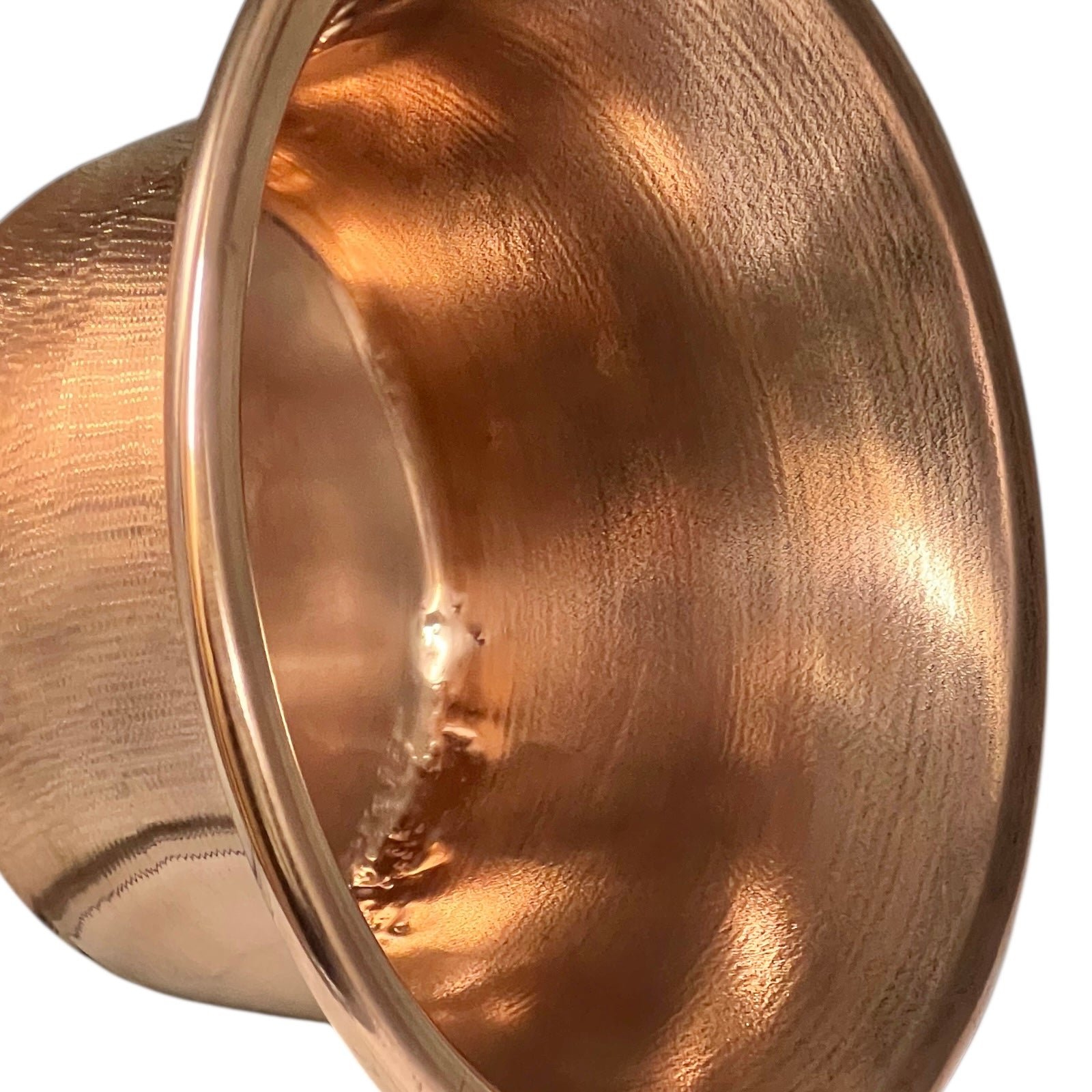 Close up of French vintage copper ladle pan with a black handle on a white background