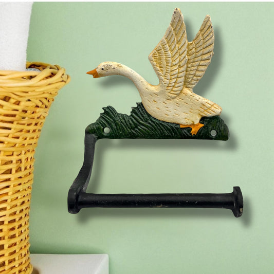 Decorative toilet paper holder shaped like a goose on a green wall for sale from All Things French Store.