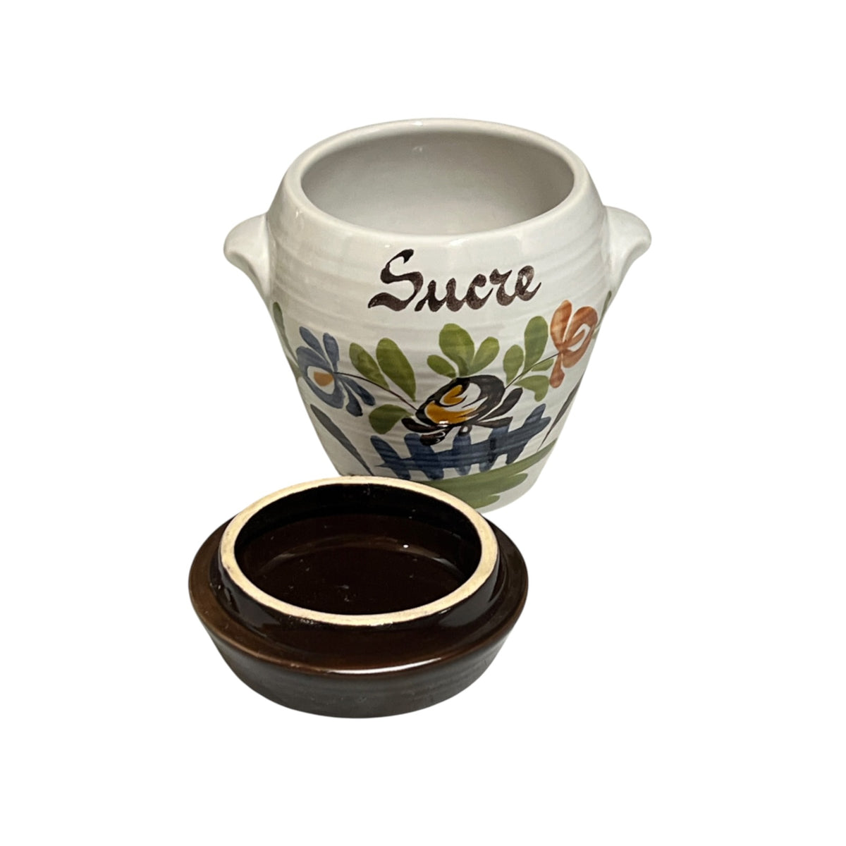 A small ceramic sugar pot with a matching lid, featuring a white body decorated with colorful floral patterns and the word 'Sucre' in brown script, alongside a dark brown glazed lid.
