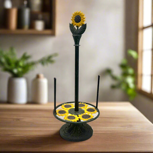 Decorative paper towel holder with sunflower design on a wooden counter in a rustic kitchen