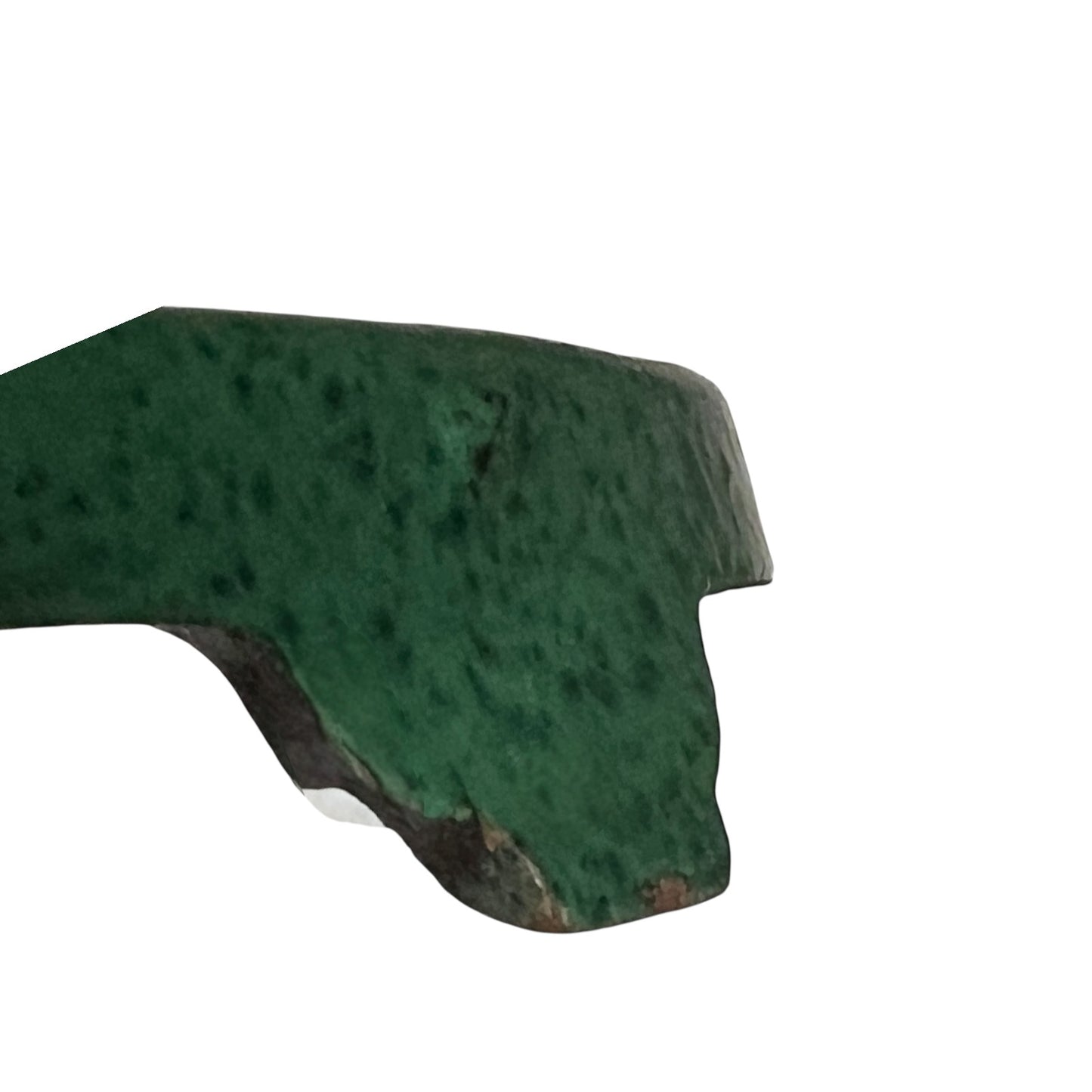Close up of a green vintage French cast iron enamelled pan trivet on a white background