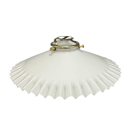 White pleated lampshade with brass fitting on a white background