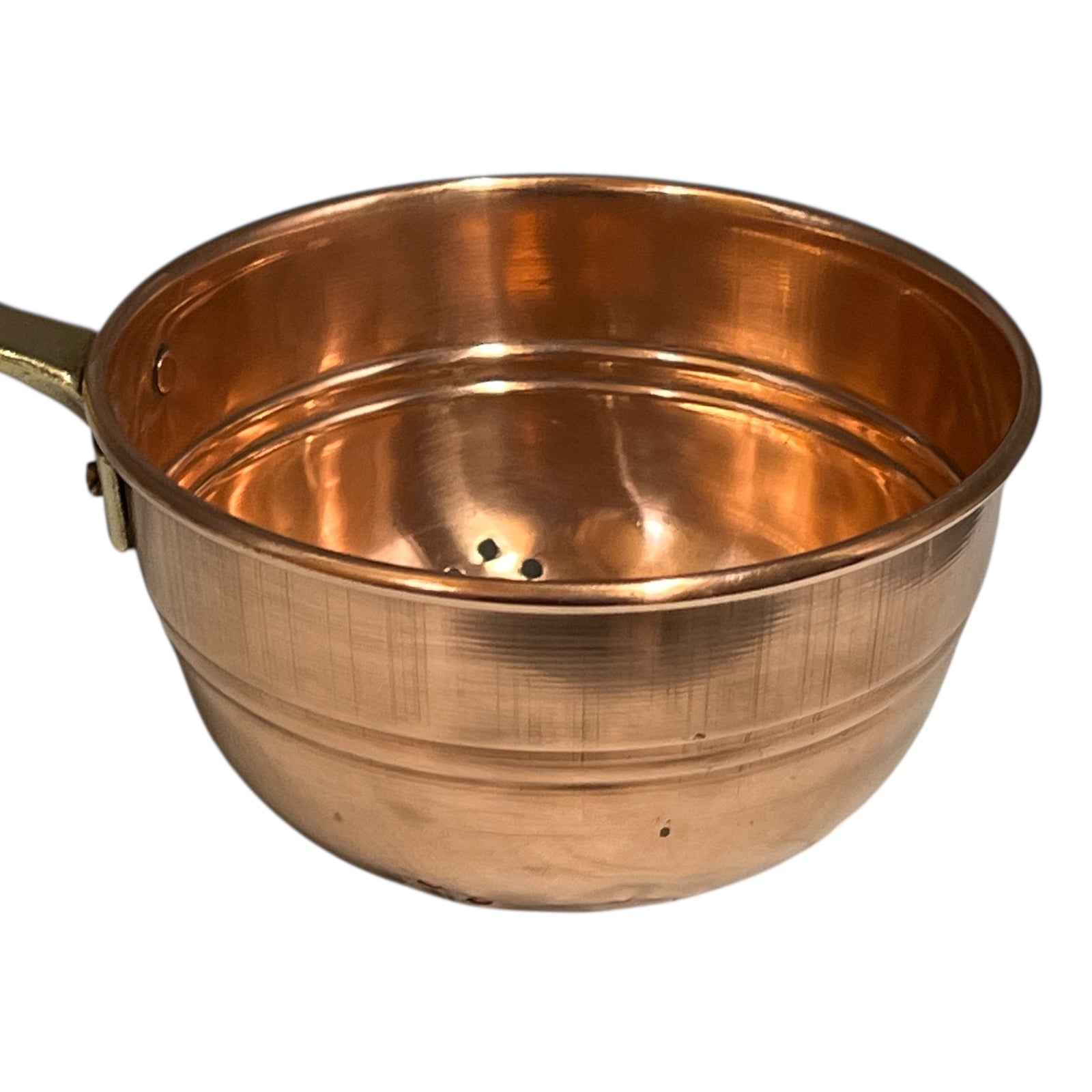 Small copper French sieve with a brass handle on a white background